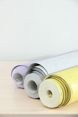 Wallpapers on wooden table in room