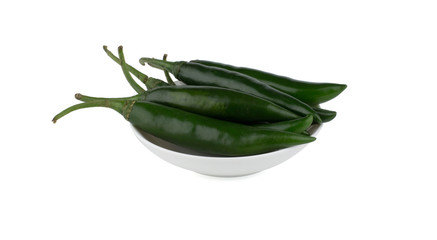 Green chlli peppers in white bowl