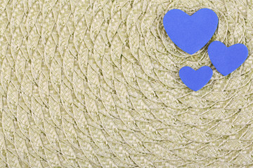 Hearts made of felt on green background