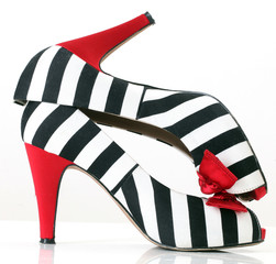 Obraz premium women's fashion black and white shoes with red heels and bow