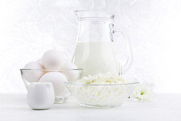 Tasty dairy products on wooden table