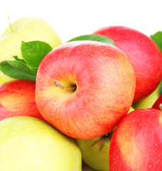 Ripe sweet apples with leaves, isolated on white