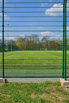 Sport, Soccer field behind the fence