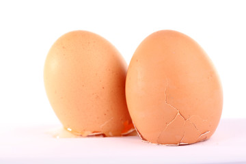 Broken eggs isolated on white