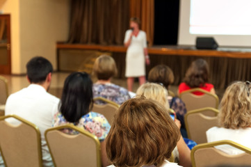people sitting rear at the business conference and speaker