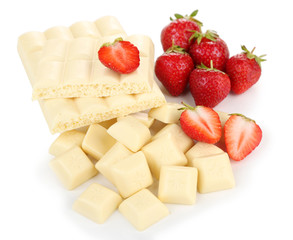 White chopped chocolate bar with fresh strawberries, isolated
