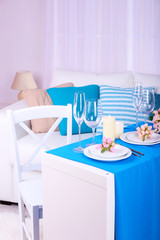 Festive table setting in interior