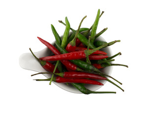 Red and green chili peppers in white bowl