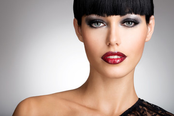 woman with  sexy red lips and fashion color eye makeup