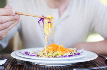 Man enjoying meal at vietnamese restaurant