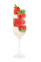 Elegant glass filled with mineral water with gas bubbles and jui