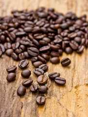 Coffee beans on wood background