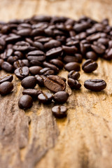 Coffee beans on wood background