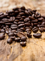 Coffee beans on wood background