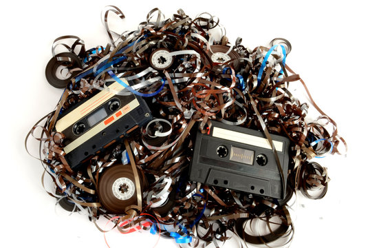 Cassettes and tape on white
