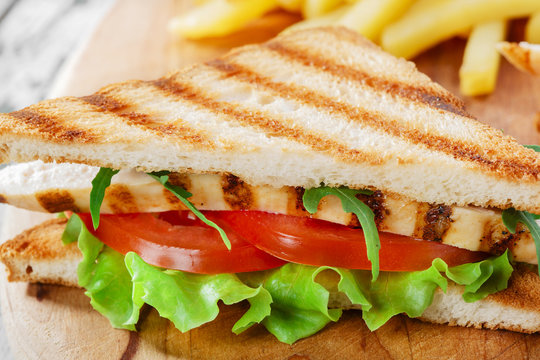 Sandwich with grilled chicken and tomatoes  french fries
