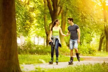 couple ride rollerblades