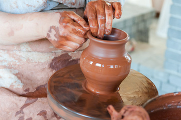 Potter making the pot in traditional style. Close up view