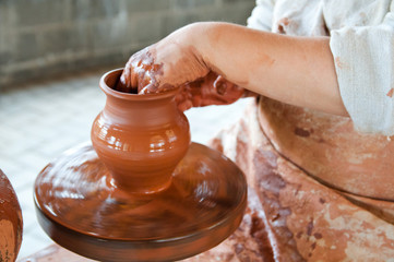 Potter making the pot in traditional style. Close up view