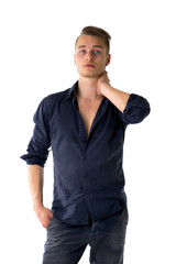 Fototapeta premium Cool confident blond young man with blue shirt and jeans