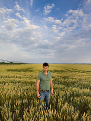 Young man in barley field