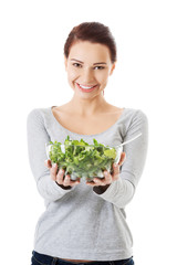 Woman eating lettuce.