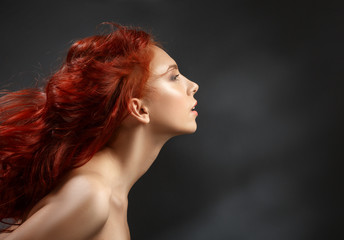red-haired girl with flying hair