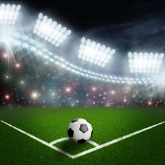 soccer ball on the green field corner