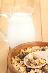 Plate with raw oatmeal on wooden table.