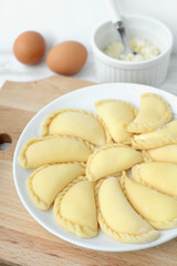 Making of varenyki or pierogy with cottage cheese (curd).