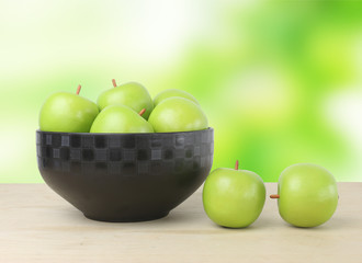green apple on wood table and green fresh background
