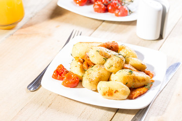 Roasted potatoes with carrot and tomatoes
