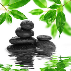spa Background -  black stones and bamboo on water