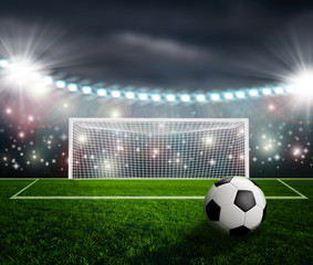 Soccer ball on green stadium arena