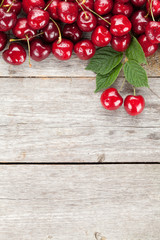 Ripe cherries on wooden table