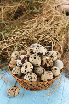 quail eggs in a wicker basket
