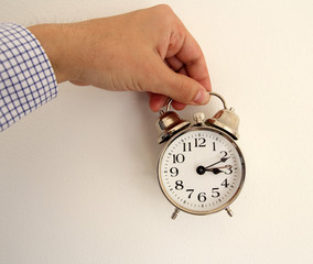 man hand holding clock