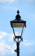 Fototapeta na wymiar Vintage street light against a blue sky