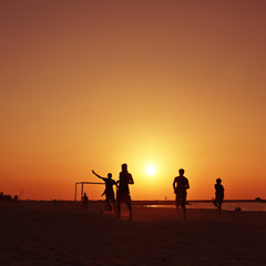 Fototapeta na wymiar Football at beach in Dubai during sunset.