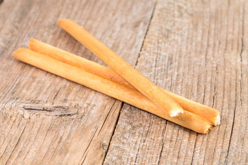 bread sticks grissini on wooden background