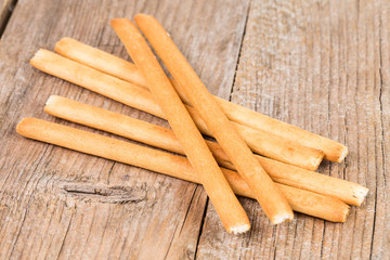 bread sticks grissini on wooden background