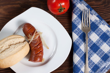 Fried sausage with onions.