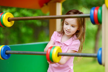 Fototapeta na wymiar A girl having fun at a playground