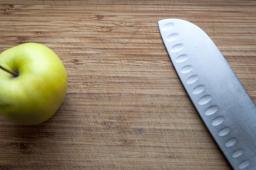 Large knife on a wooden board