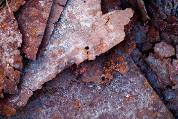 Sharp edges of the rusty metal sheets