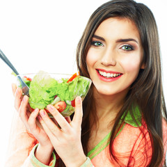 Young woman eat salad. Healthy vegetarian food.