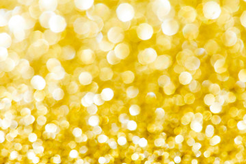 Abstract holidays golden lights on background