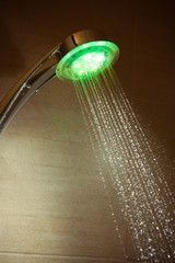 illuminating shower with flowing water
