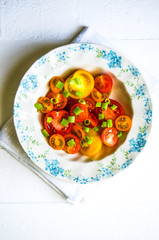 Colorful tomatoes with onion