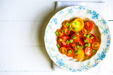 Colorful tomatoes with onion